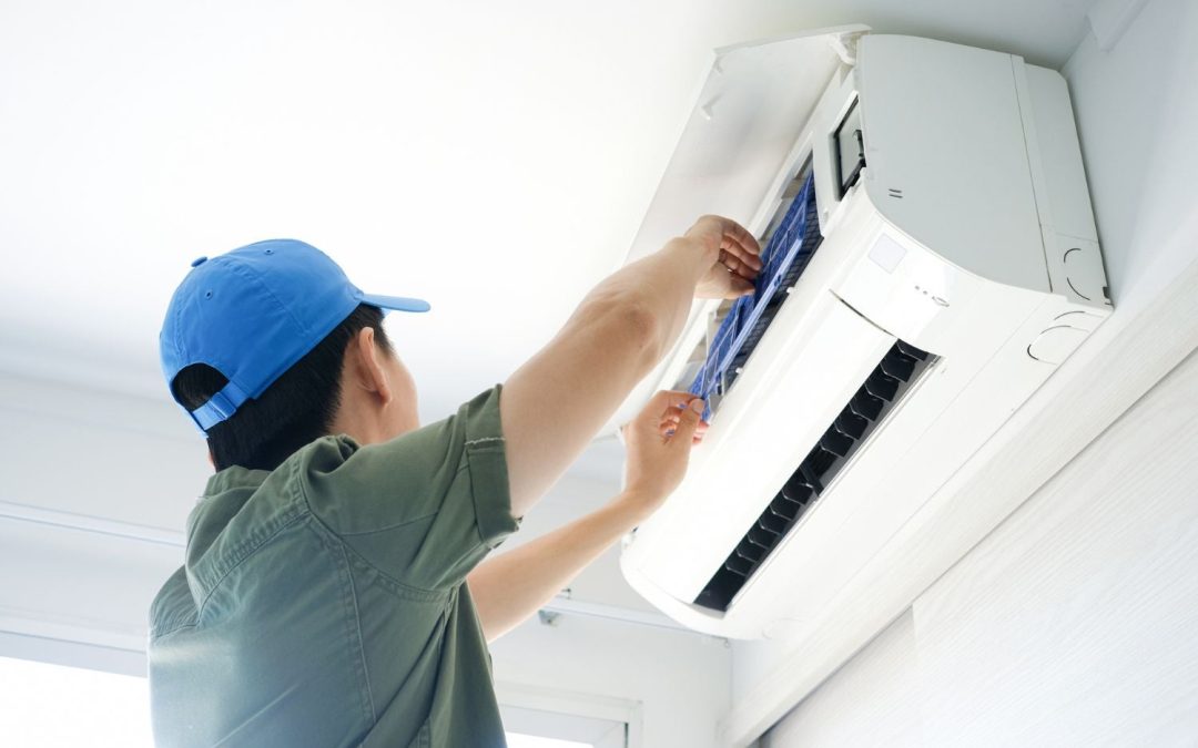 HVAC technician servicing a ductless mini split in West Covina